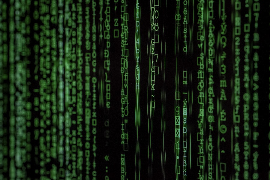 Darkened office with code on screen representing a data breach